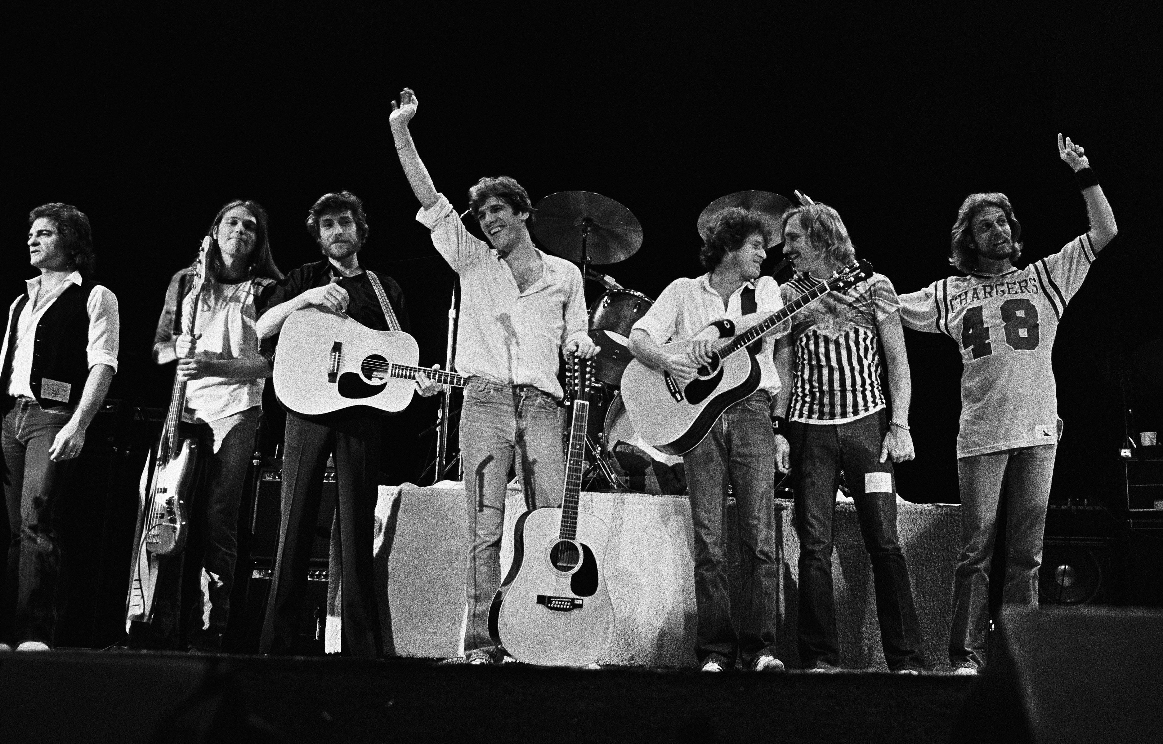 Joe Vitale, Timothy B. Schmit, JD Souther, Glenn Frey, Don Henley, Joe Walsh and Don Felder following their performance at the San Diego Sports Arena in San Diego, California, December 1979 | Source: Getty Images