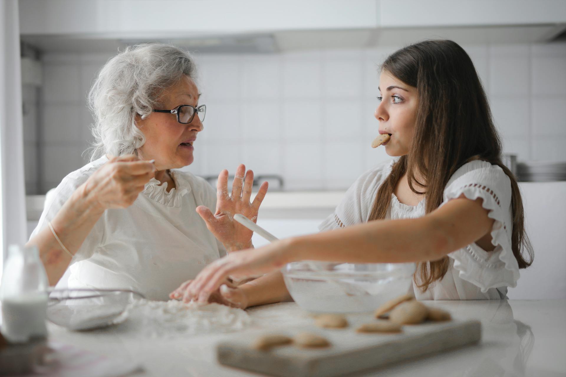 A girl sitting with her grandmother | Source: Pexels